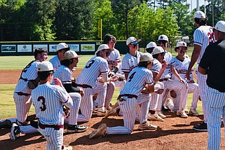 Liberty-Eylau head baseball coach Zach Fowler talks to his team following the Leopards' 3-2 District 15-4A victory over Pleasant Grove before a packed house earlier in the season at H.E. Markham Park. (Photo by Timothy Brown, L-E School Board)